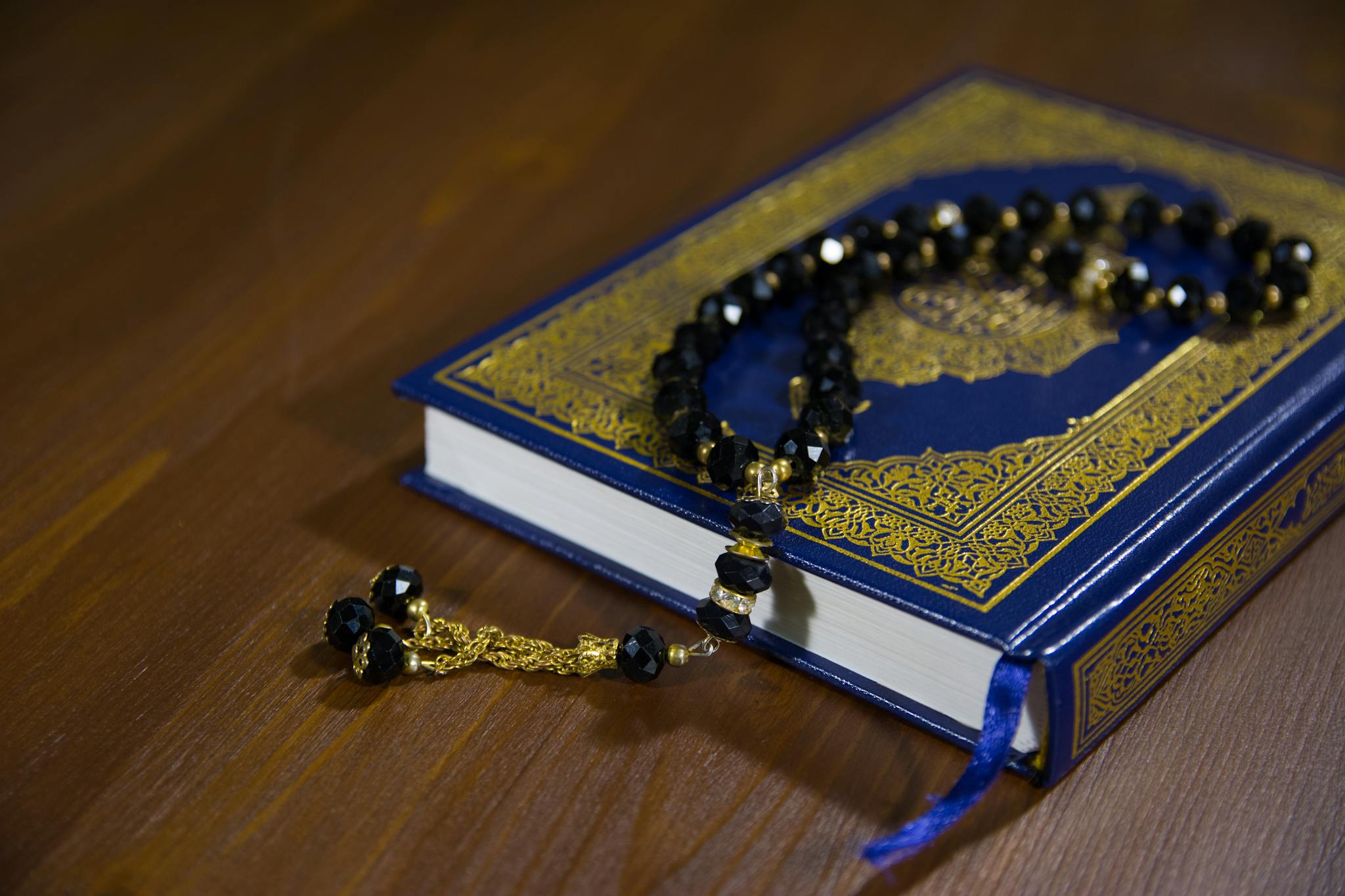 Close-Up Shot of Prayer Beads on a Book