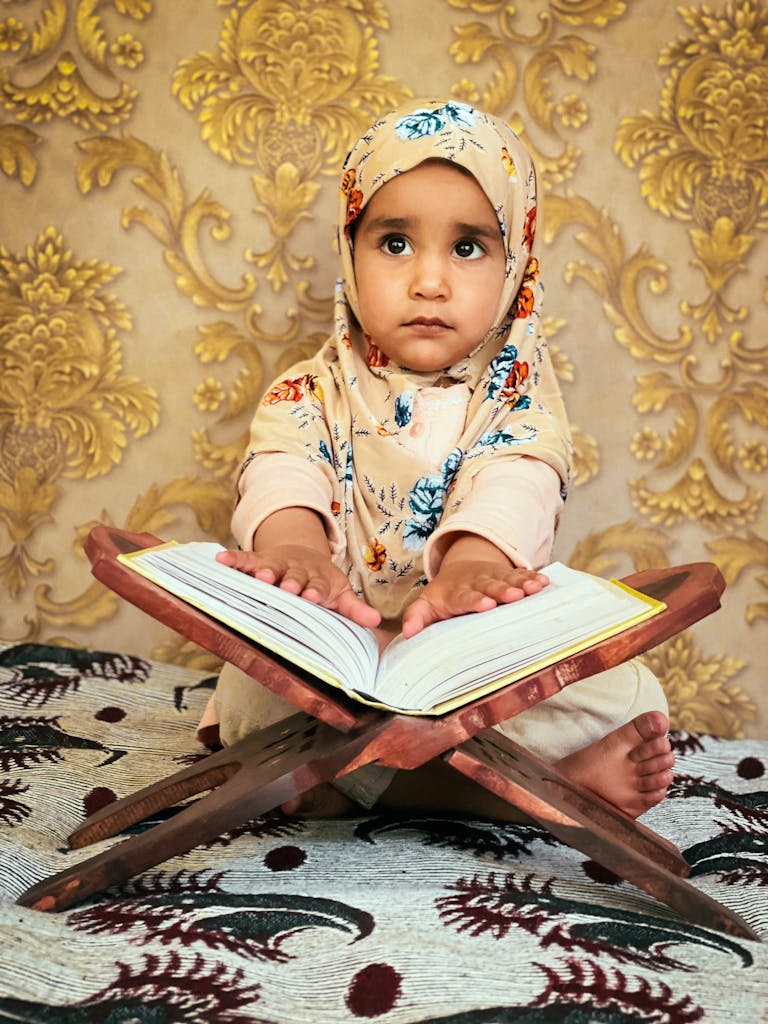 A Child Reading Quran during Ramzan-full quran translation in hindi pdf download